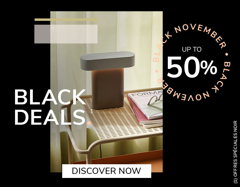Discover More Elegant designer table lamp on natural stone base with gold stem and white shade, promoting Black November sale – up to 40% off with text ‘First Black Deals’ and ‘Discover More’ button.